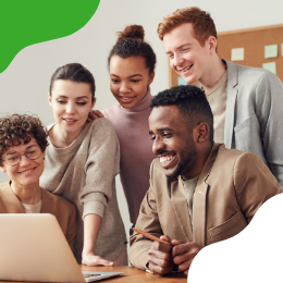 People looking at a computer and smiling 