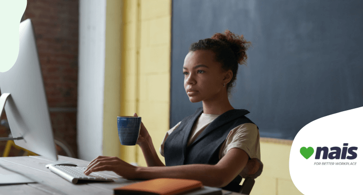 woman sitting on chair staring at the computer